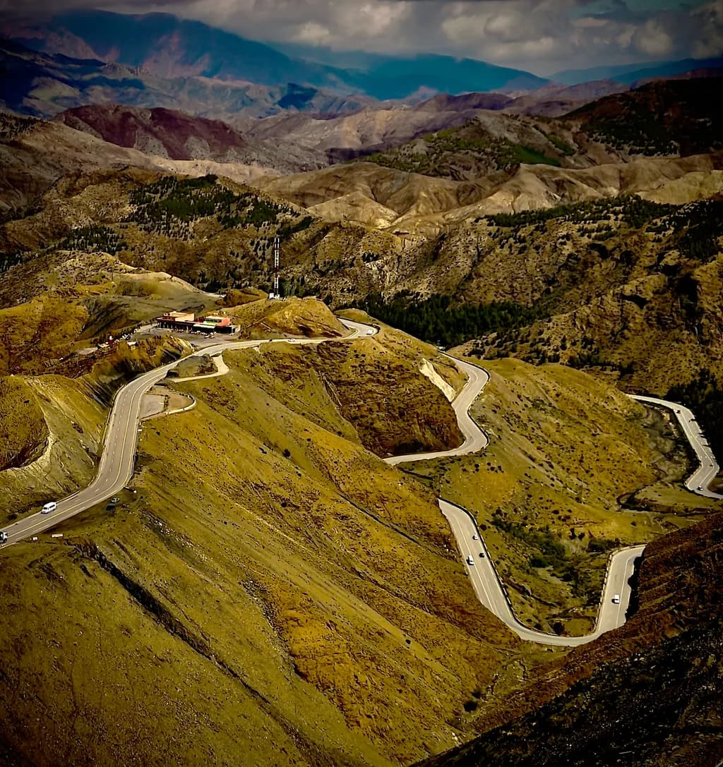Winding Paths Through Majestic Mountains: A Journey of Nature's Curves
