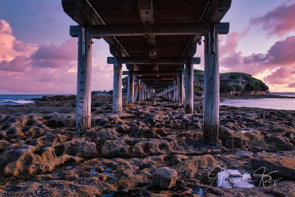 Whispers of Tranquility: A Sunset Beneath the Pier