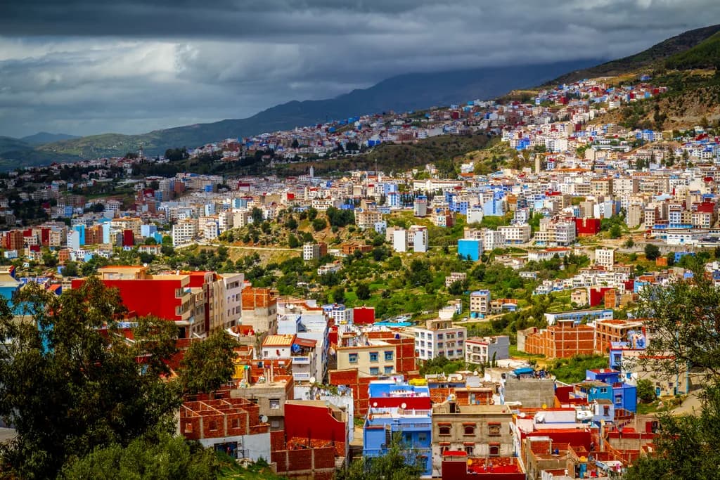 Vibrant Mosaic: A Panoramic View of Colorful Urban Life in the Hills of Morocco