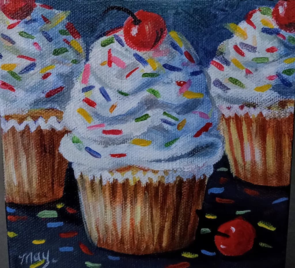 Cupcakes with sprinkles and cherries