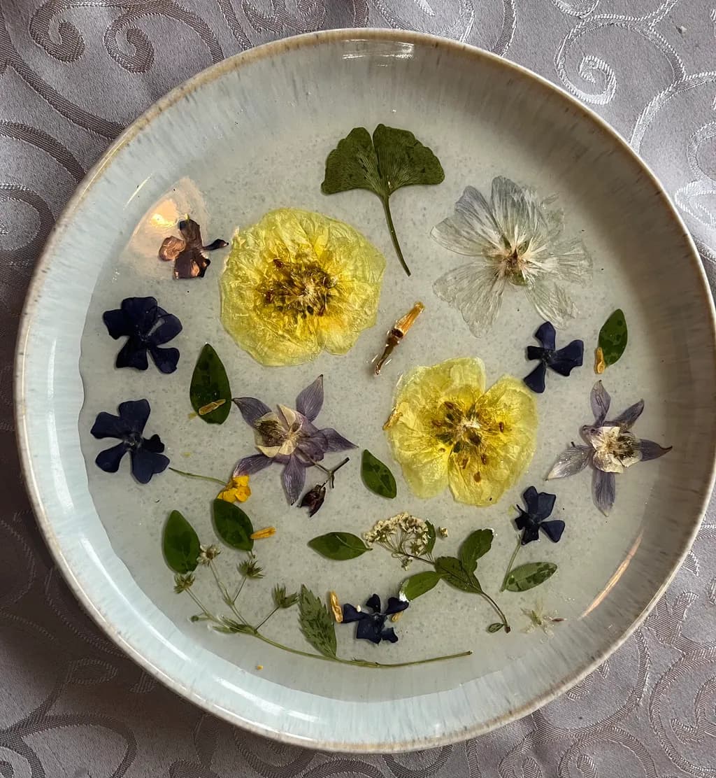 Ethereal Floral Harmony: A Delicate Dance of Pressed Petals and Leaves in Porcelain Elegance