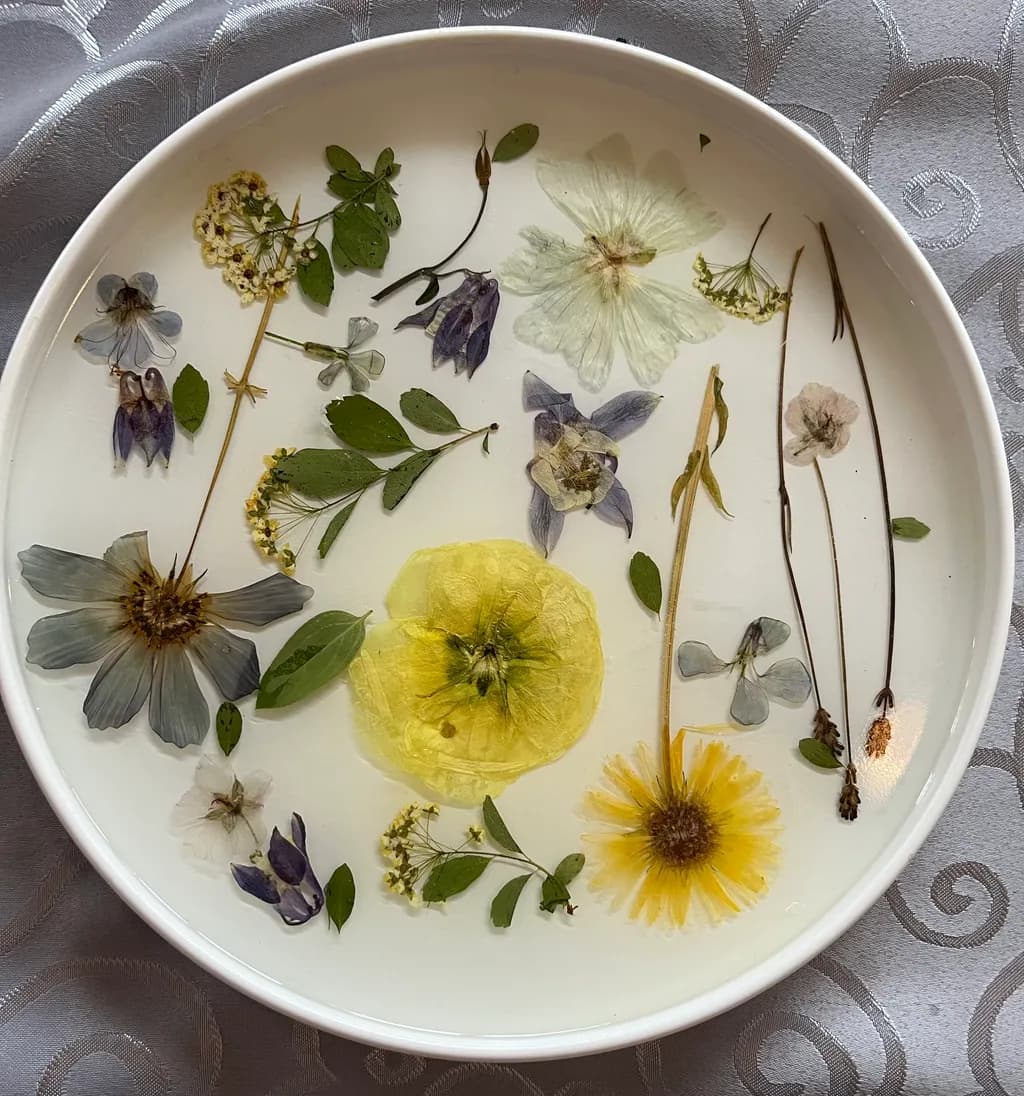 Ethereal Floral Harmony: A Delicate Arrangement of Pressed Blooms and Leaves