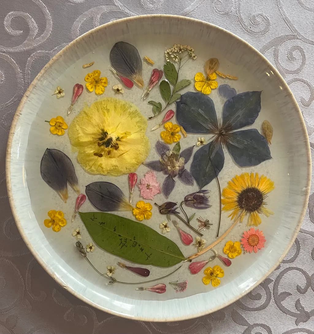 Floral Harmony: A Delicate Arrangement of Pressed Blooms in Ceramics
