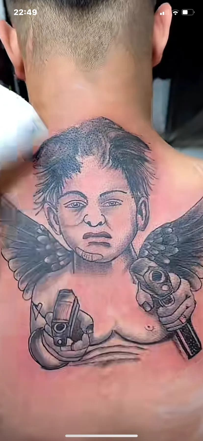 Ethereal Guardian: A Tattoo of Innocence and Power