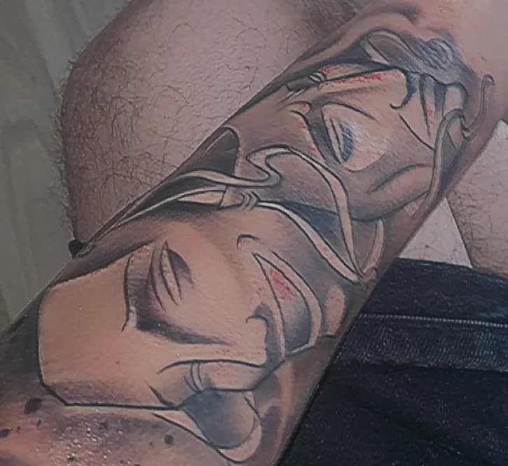 Ethereal Embrace: A Tattoo of Dual Faces in Harmony