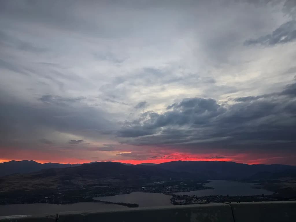 Whispers of Dusk: A Serene Sunset Over the Lake and Mountains