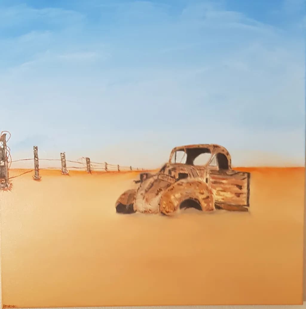 Deserted Dreams: The Rusting Beauty of a Forgotten Truck in the Sands of Time