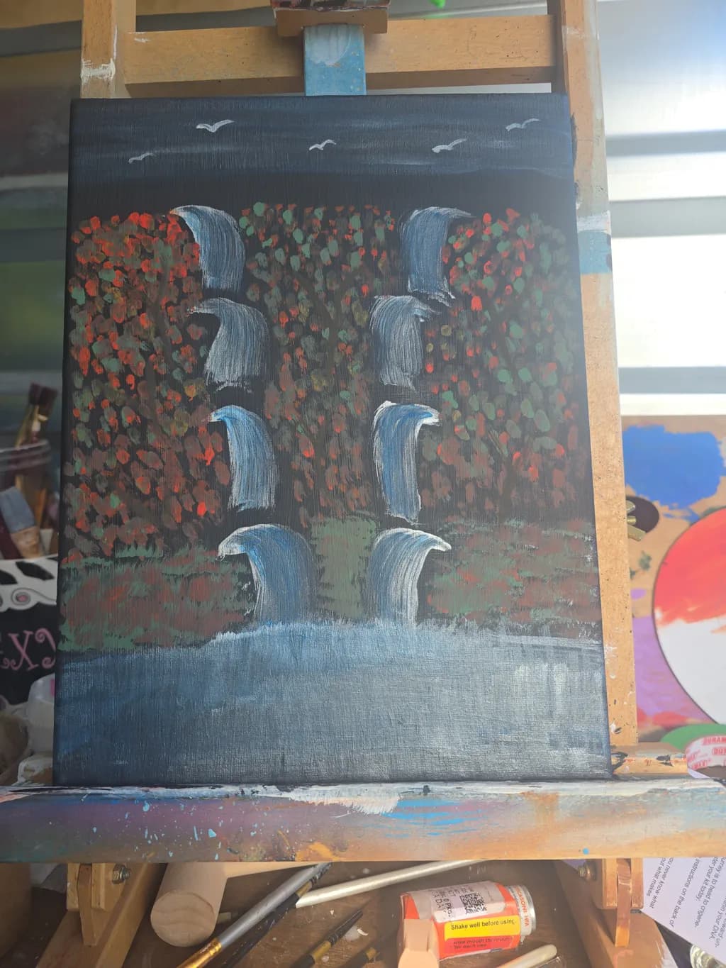 Whispers of Autumn: Cascading Waters Amidst a Colorful Canopy