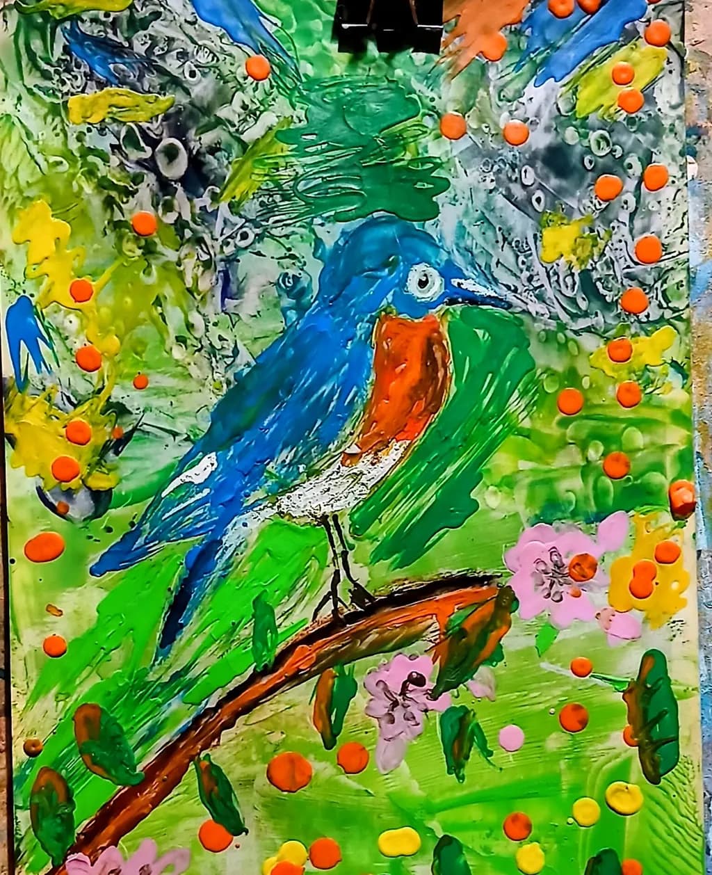 Vibrant Harmony: A Colorful Bluebird Amidst Blossoms and Nature's Palette