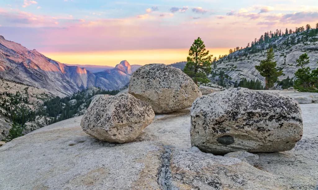 Serenity at Dusk: Majestic Rocks Overlooking Yosemite's Vibrant Horizon