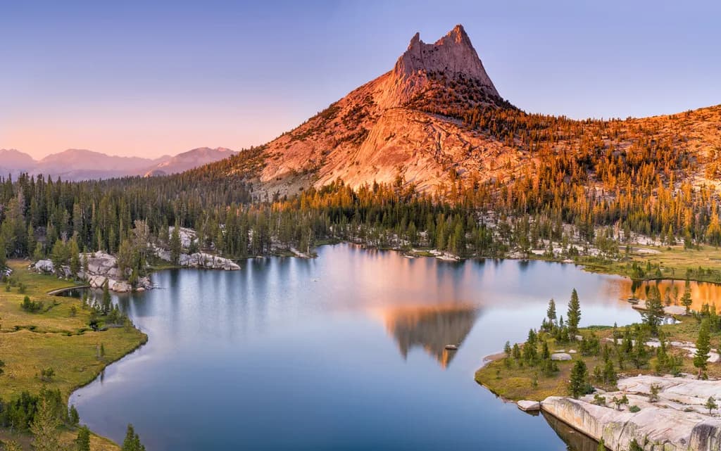 Majestic Reflections: The Serene Beauty of a Mountain Lake at Dawn