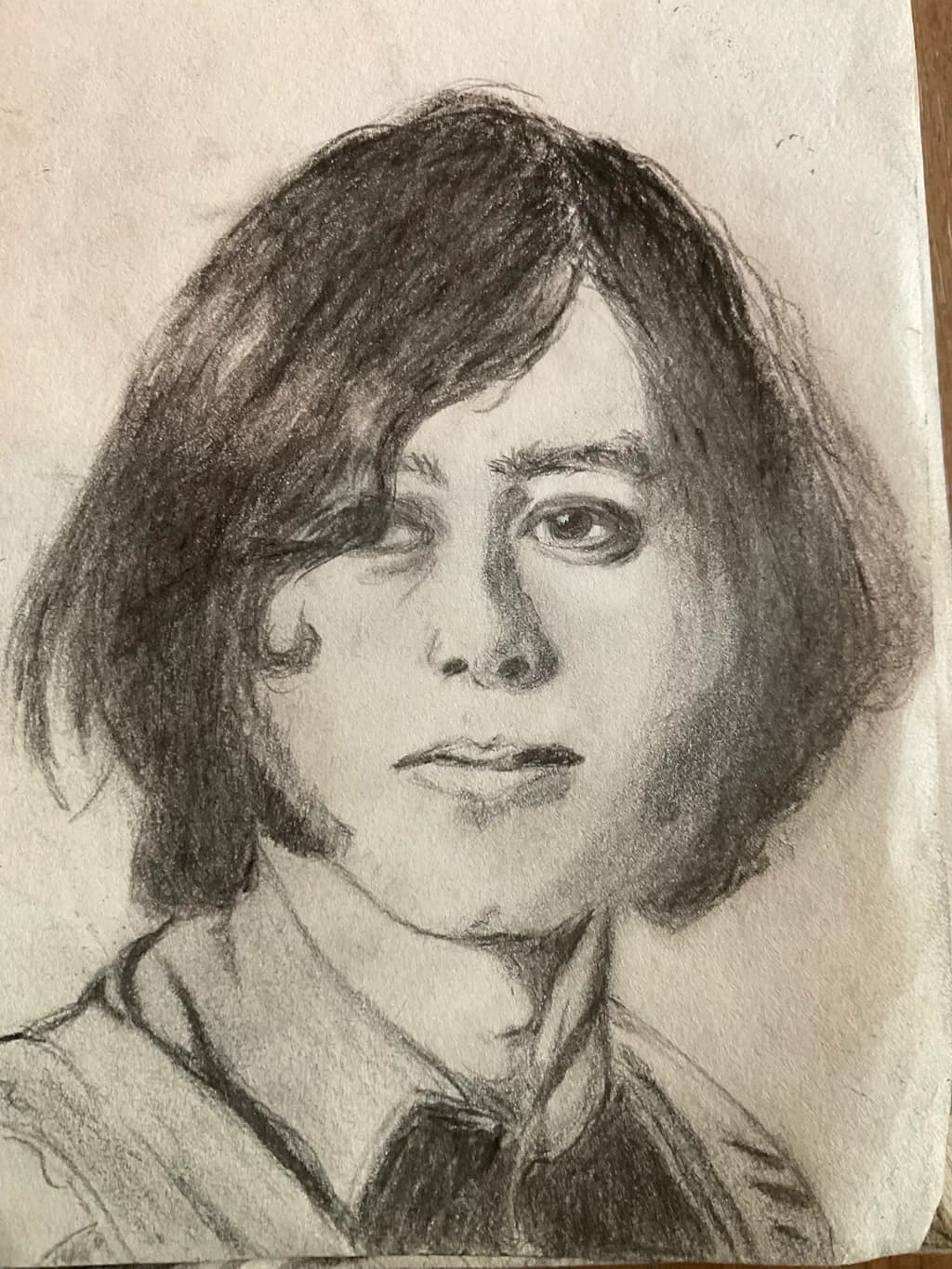Whispers of Youth: A Charcoal Portrait of Reflection and Identity