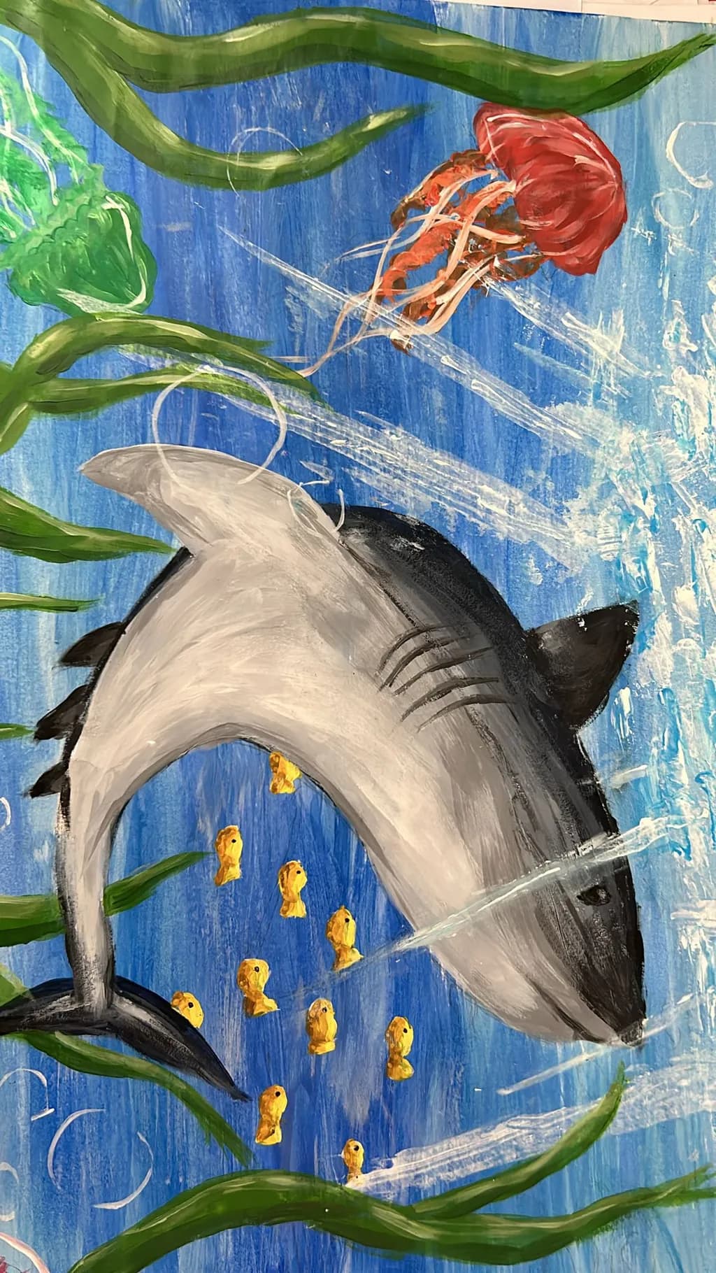 Oceanic Dance: A Shark's Journey Through Colorful Waters with Jellyfish and Goldfish Companions
