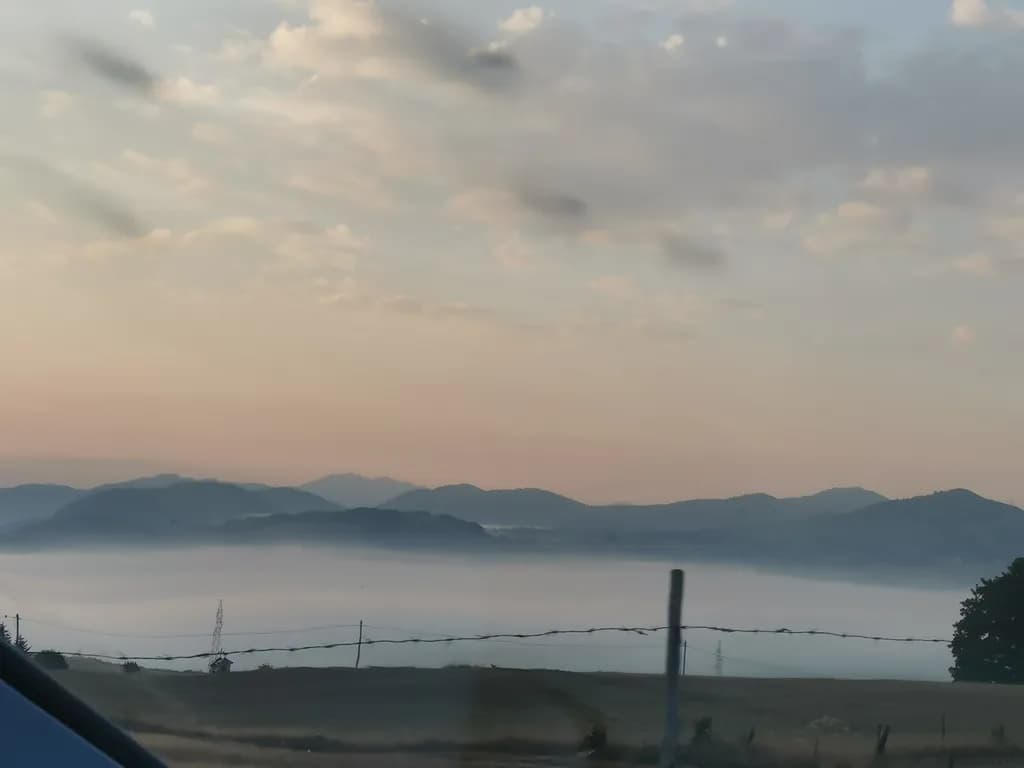 Whispers of Dawn: A Serene Mountain Landscape at Sunrise