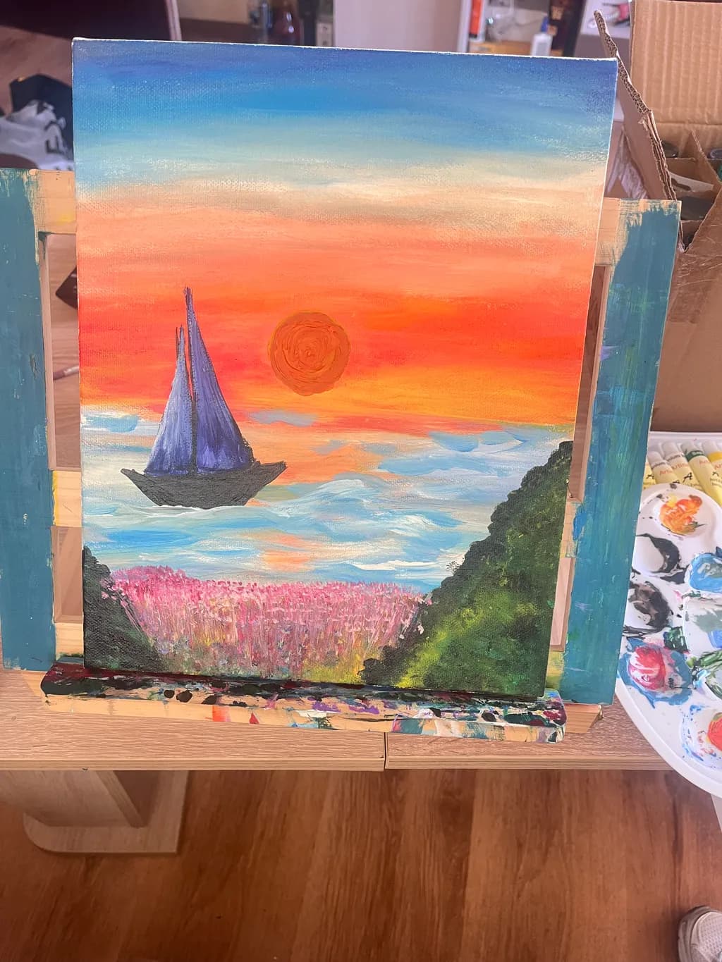 Serene Sunset Voyage: A Sailboat's Journey Through Vibrant Skies and Blossoming Horizons