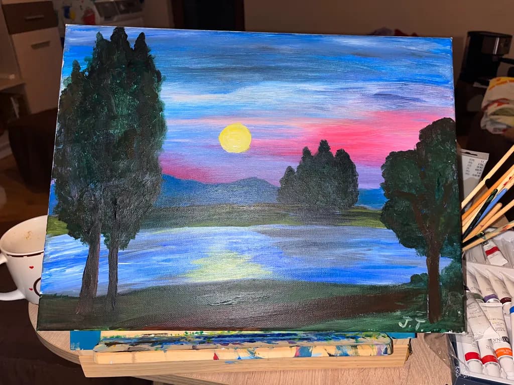 Serene Sunset Reflections: A Colorful Landscape of Trees and Water