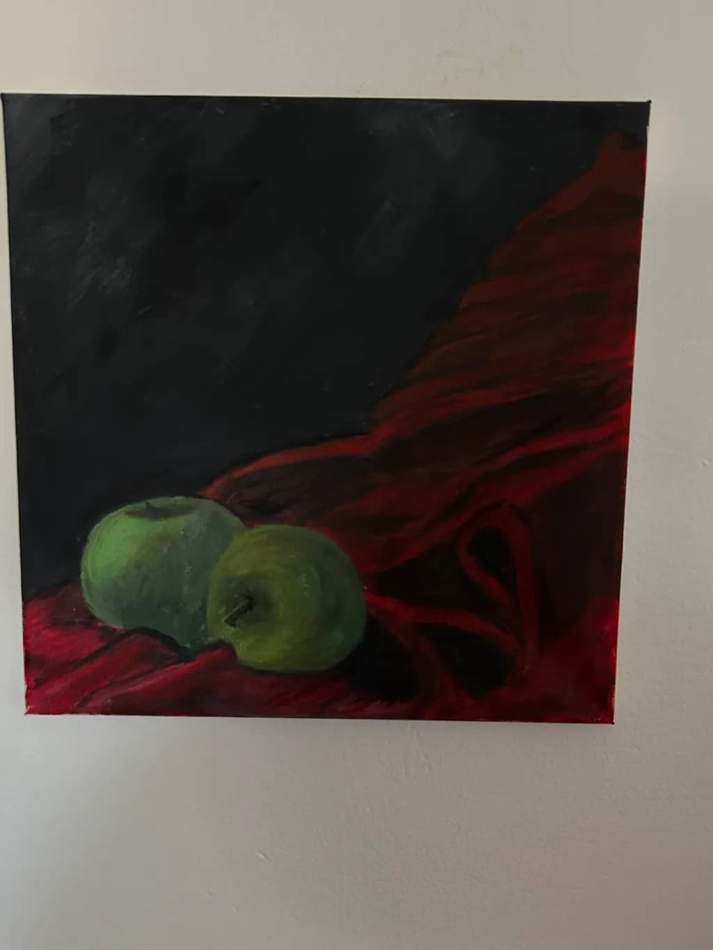 Whispers of Green: Apples on Crimson Velvet
