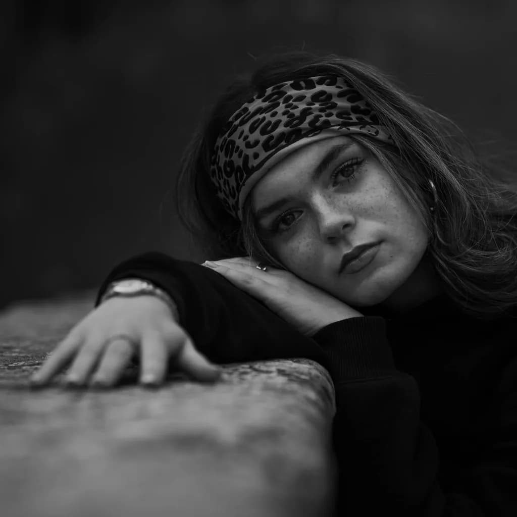 Whispers of Contemplation: A Monochrome Portrait of Thoughtfulness and Freckles