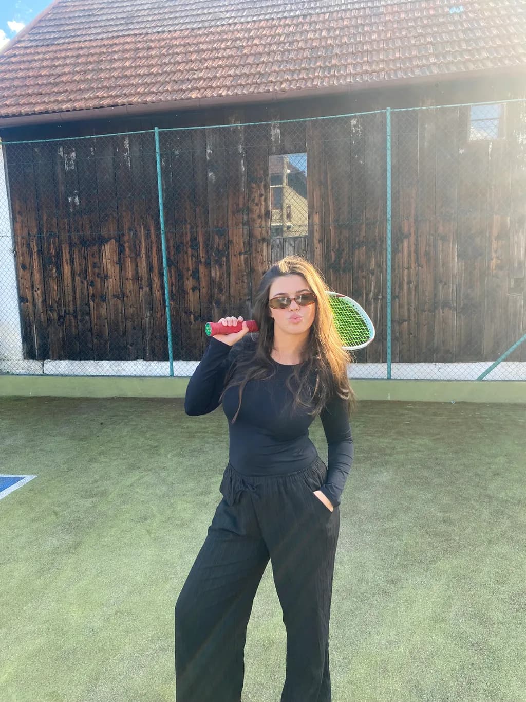 Sporty Elegance: A Playful Moment on the Tennis Court