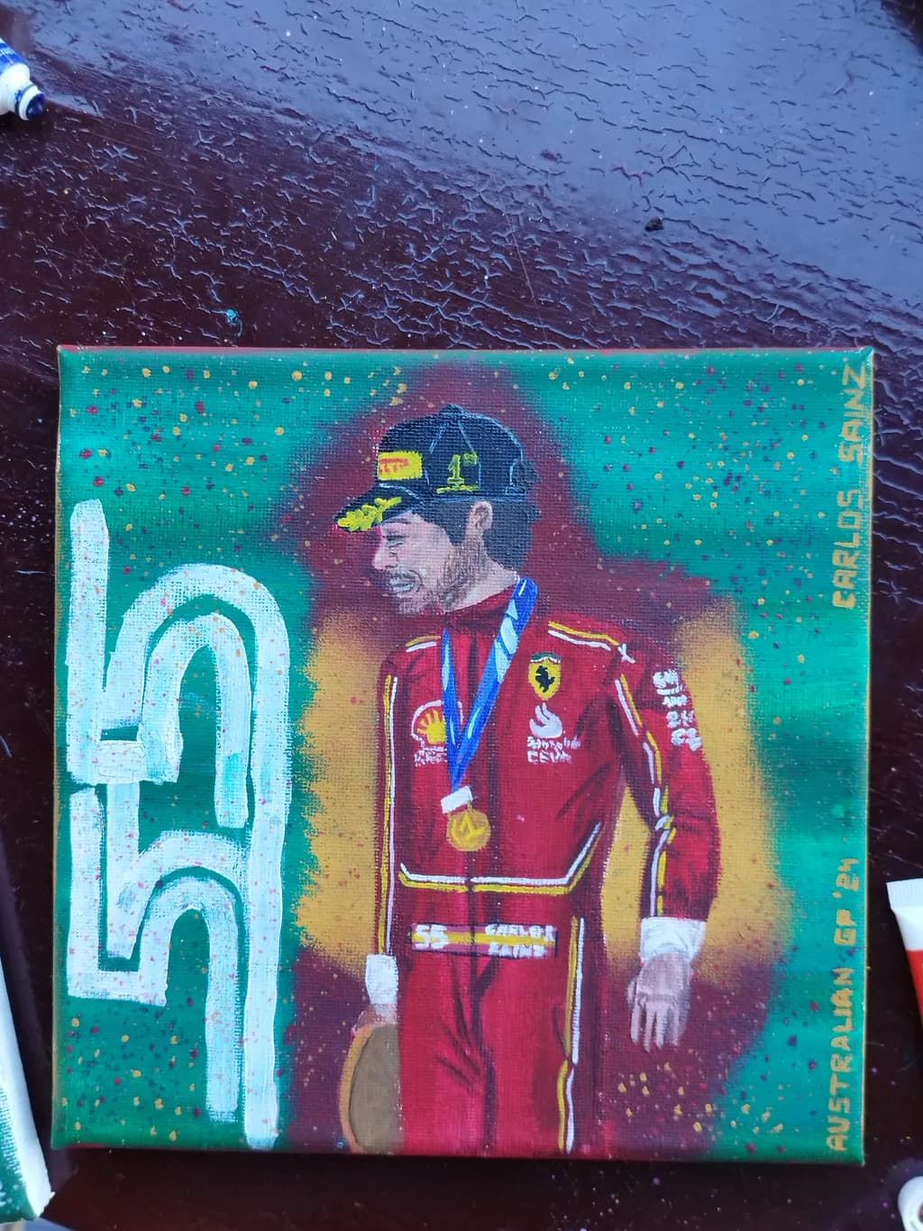 Celebrating Victory: Carlos Sainz in Ferrari Glory