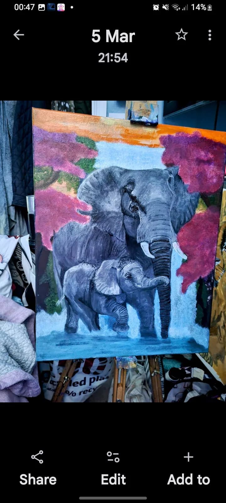 Majestic Bonds: A Mother and Calf Elephant Embrace in Vibrant Harmony