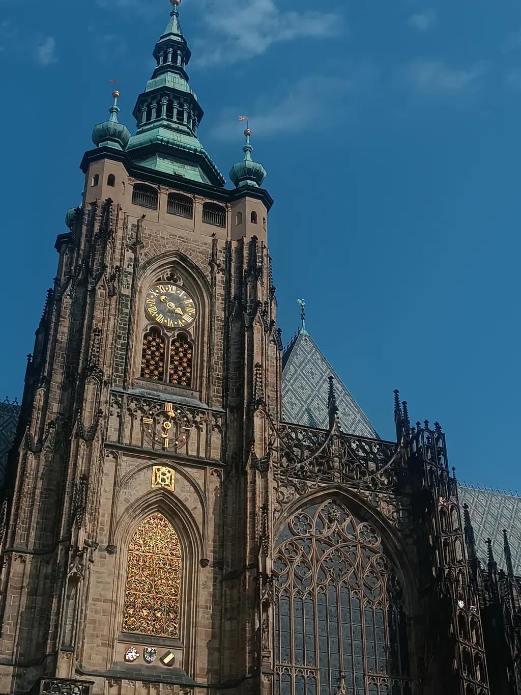 Majestic Spires: A Glimpse of St. Vitus Cathedral Under the Blue Sky