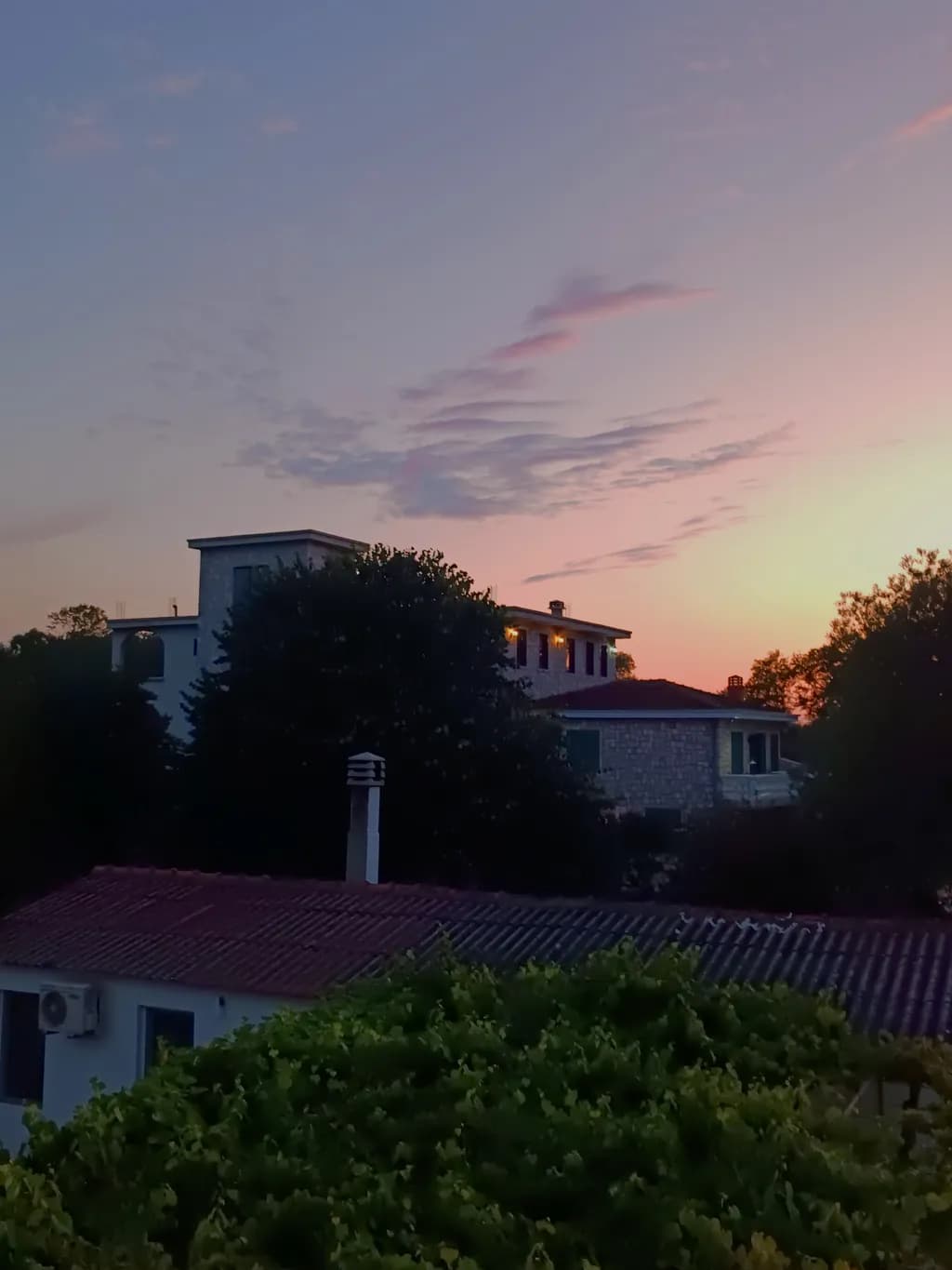 Whispers of Dusk: A Serene Sunset Over Tranquil Homes