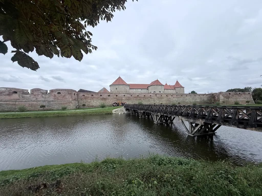 Whispers of History: The Majestic Fortress by the Serene Riverbank