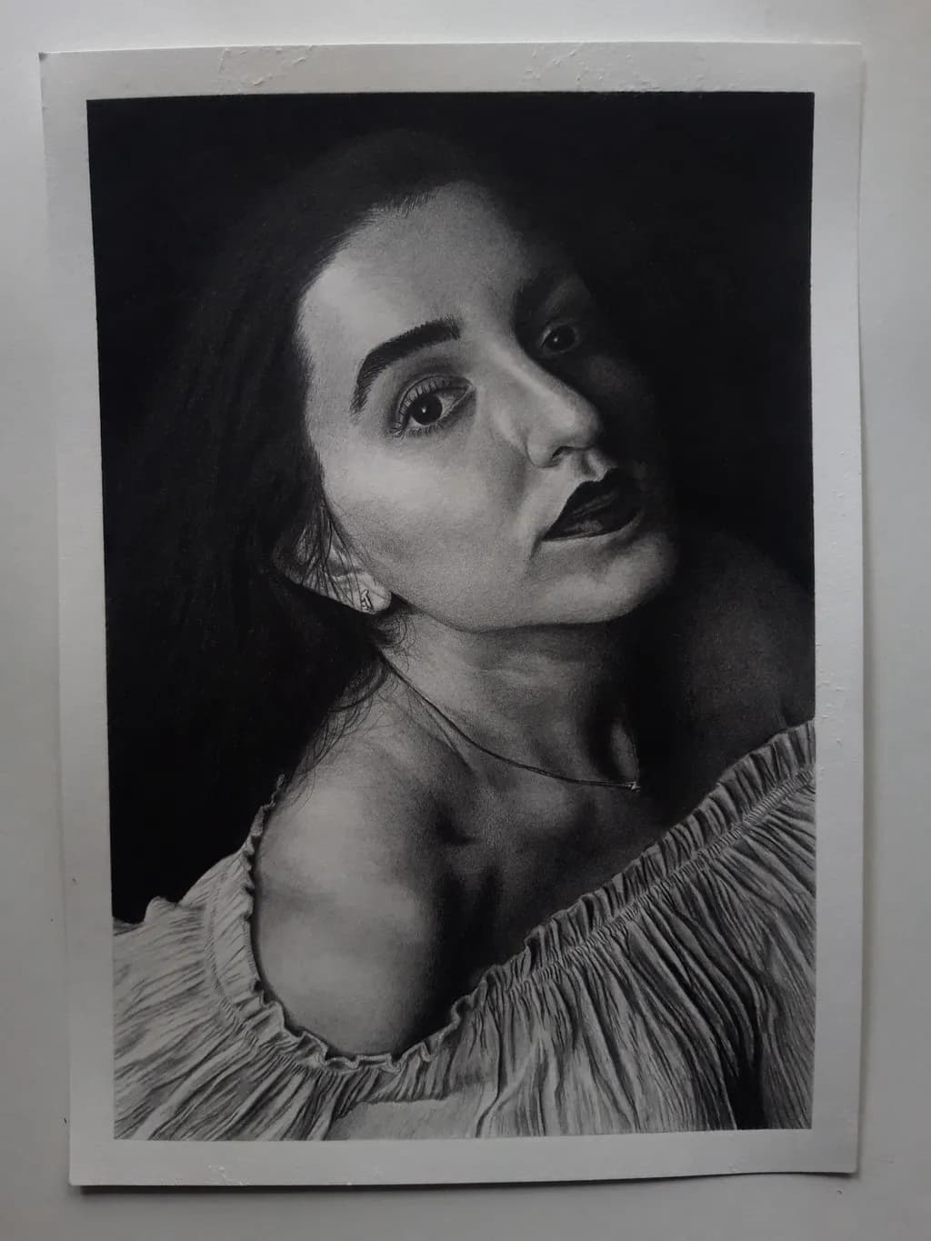 Whispers of Elegance: A Captivating Portrait in Charcoal and Light