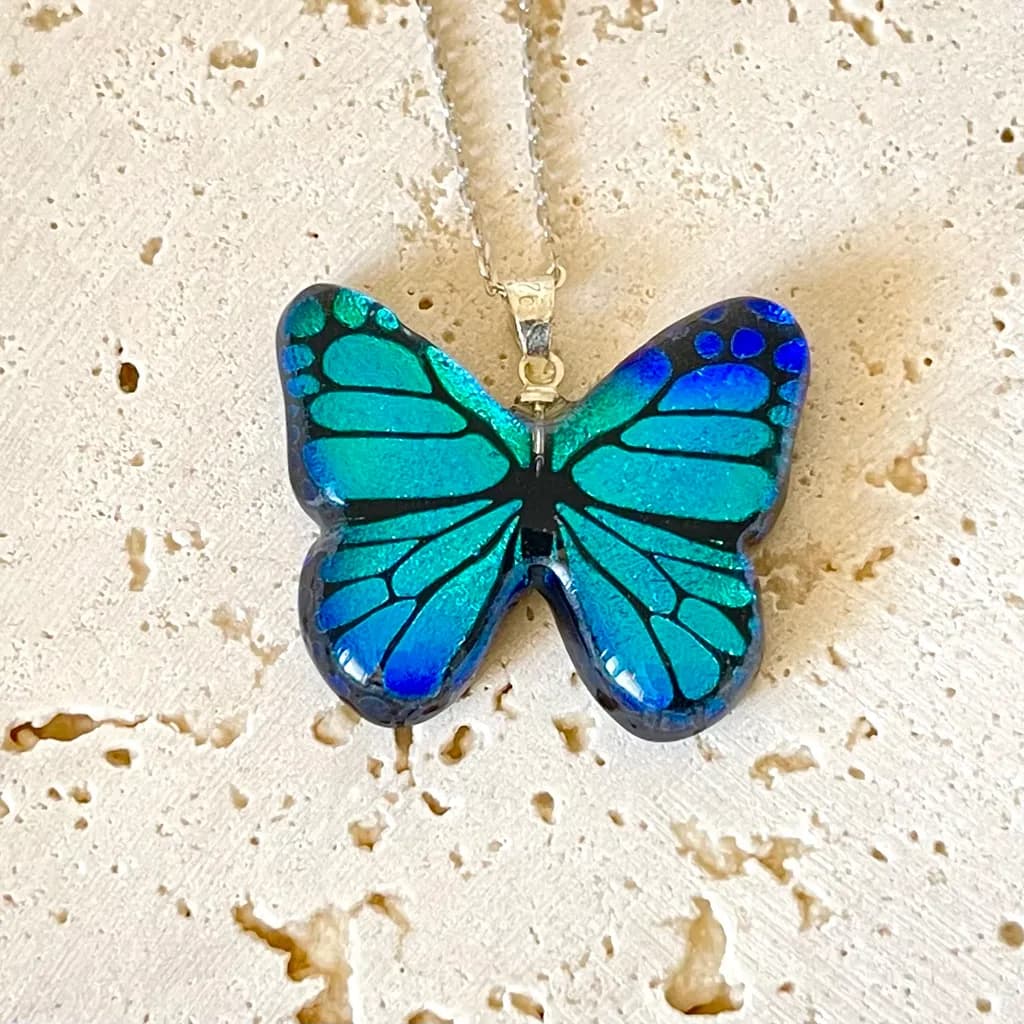 Whispers of the Ocean: Iridescent Blue Butterfly Pendant Necklace