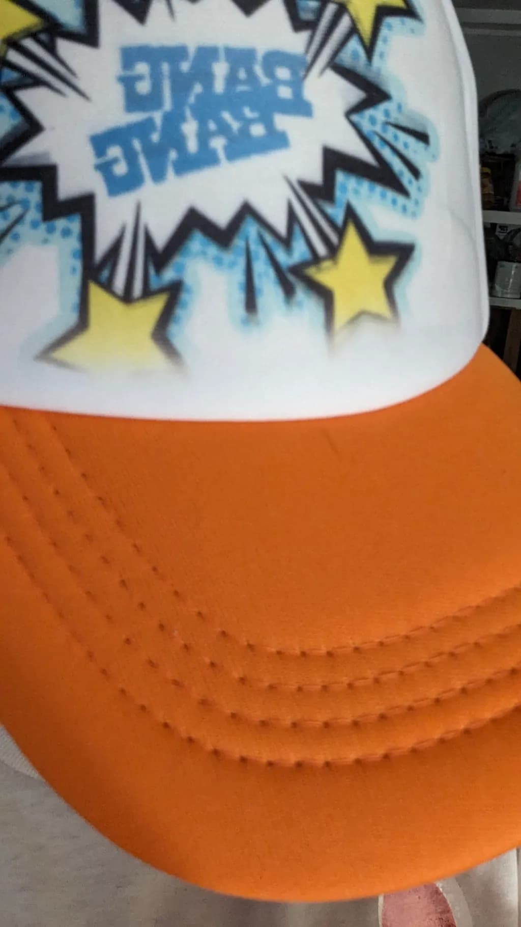 Vibrant Pop Art Cap: "BAM!" with Stars and Energy Burst Design