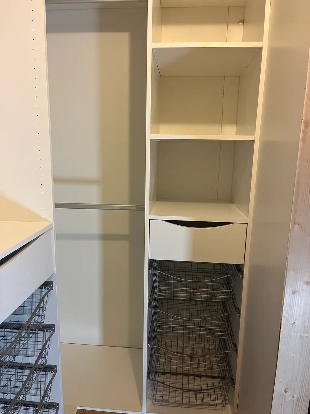 Minimalist Storage Solution: Sleek White Closet Organizer with Wire Baskets and Drawer