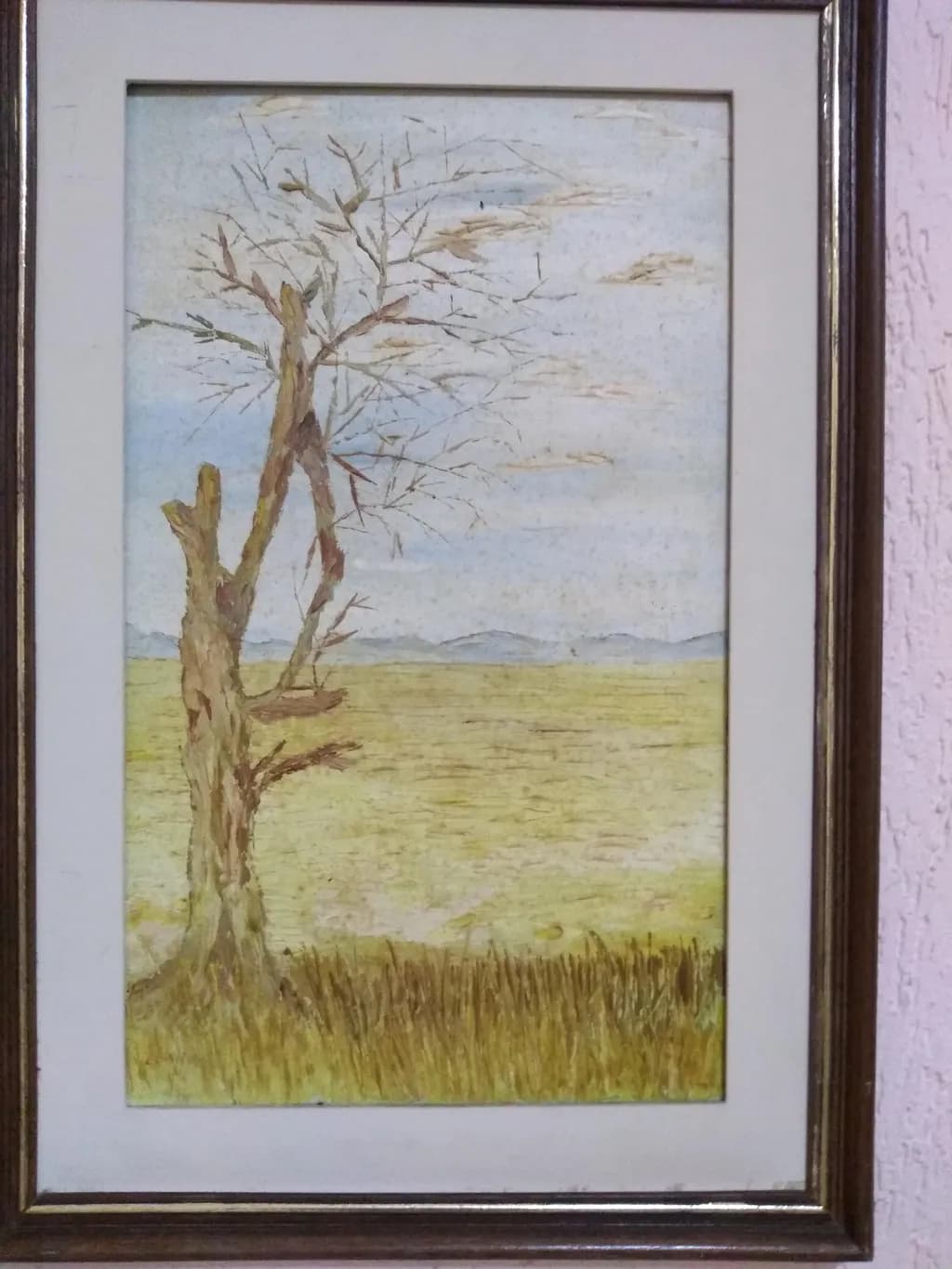 Whispers of Nature: A Solitary Tree in a Golden Landscape