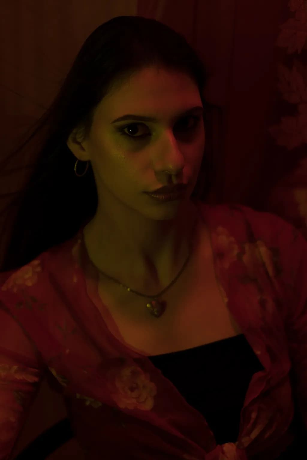 Whispers of Light: A Portrait in Crimson and Shadow