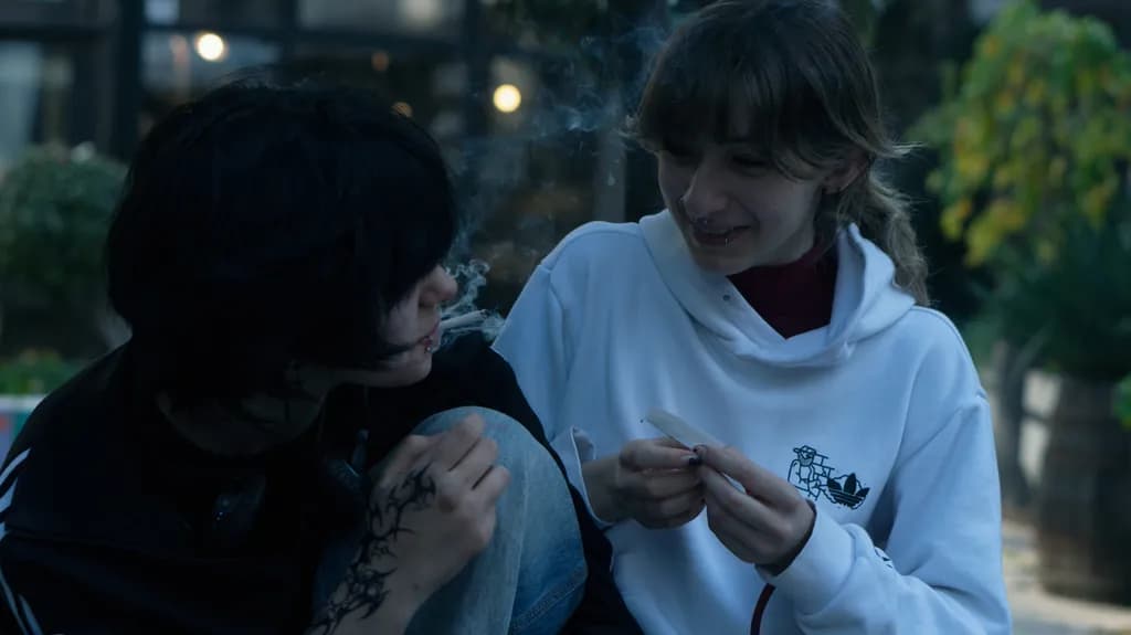 Urban Conversations: Friends in Smoke Under the Night Sky