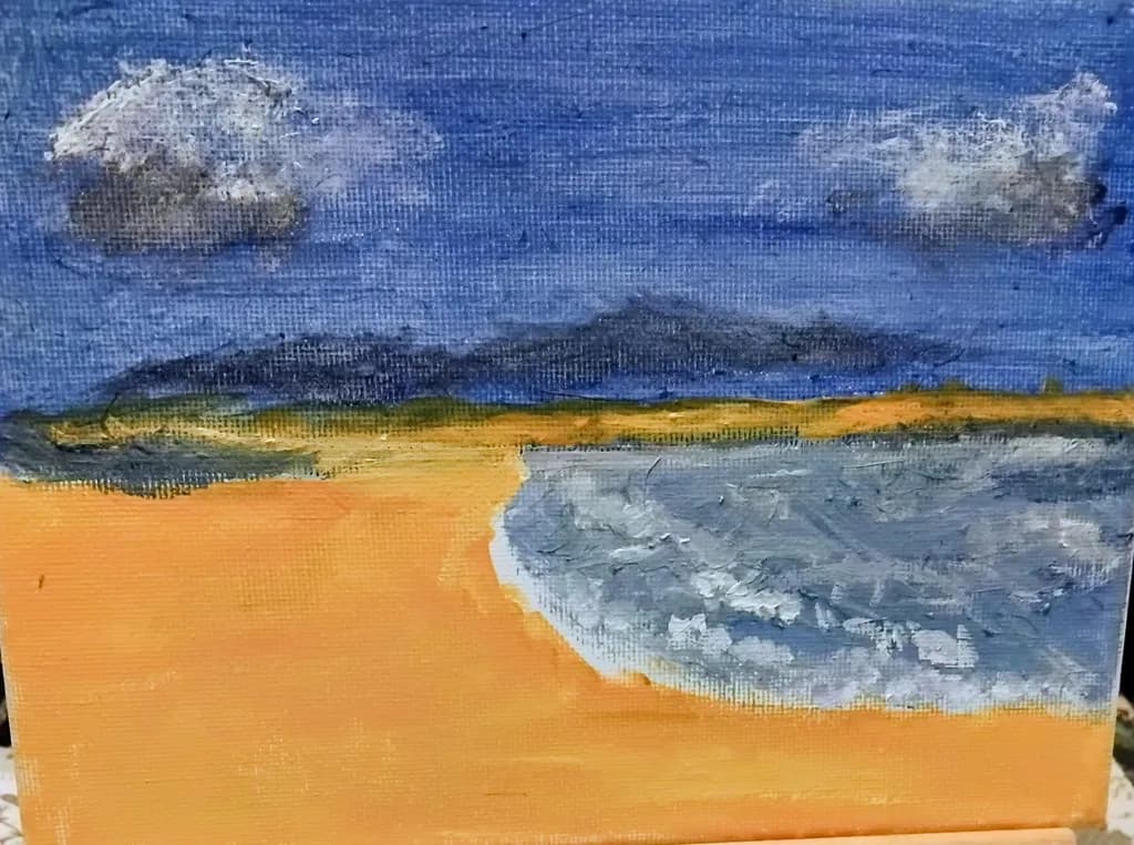 Serene Coastal Escape: A Tranquil Beach Scene with Gentle Waves and Soft Clouds