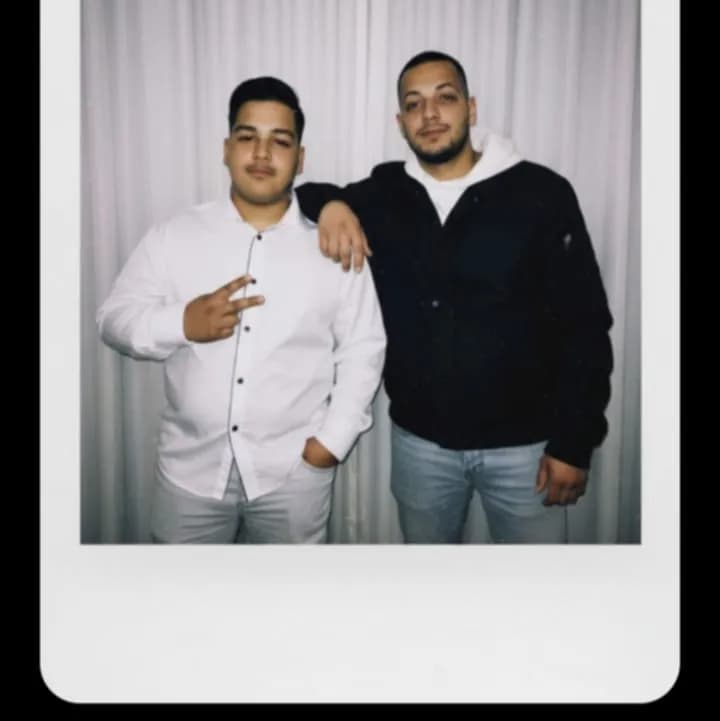 Brothers in Style: A Timeless Moment Captured in Polaroid Elegance