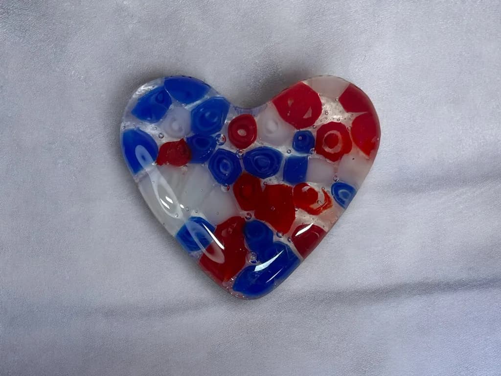 Vibrant Heart of Glass: Red, White, and Blue Fused Artistry