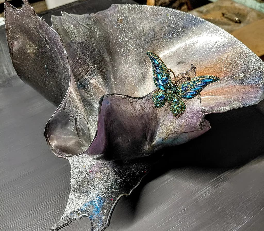 Whispers of Transformation: A Shimmering Butterfly Embraced by an Iridescent Shell