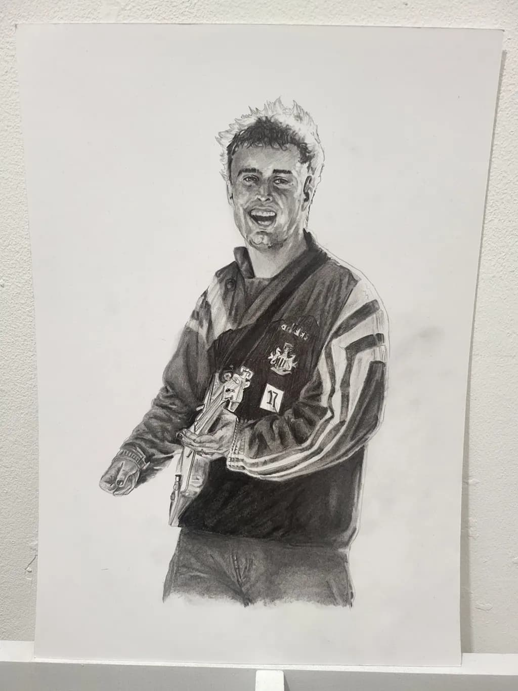 Vibrant Strums: A Charcoal Portrait of Joyful Expression in Music