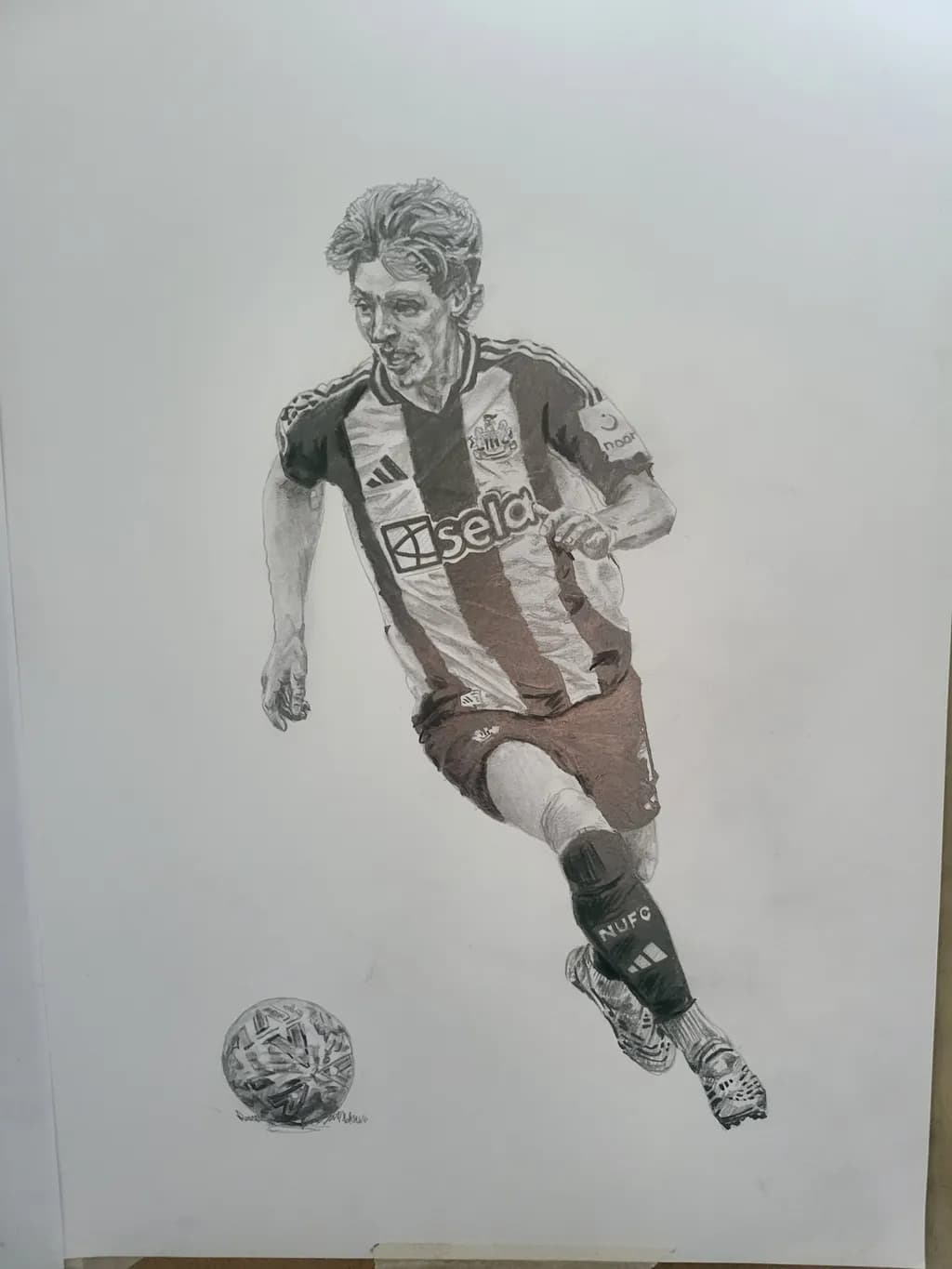 Dynamic Footballer in Motion: A Captivating Pencil Sketch of Athleticism and Passion