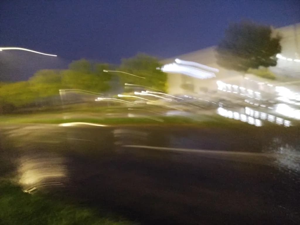 Whispers of Rain: A Dance of Light and Motion in the Night