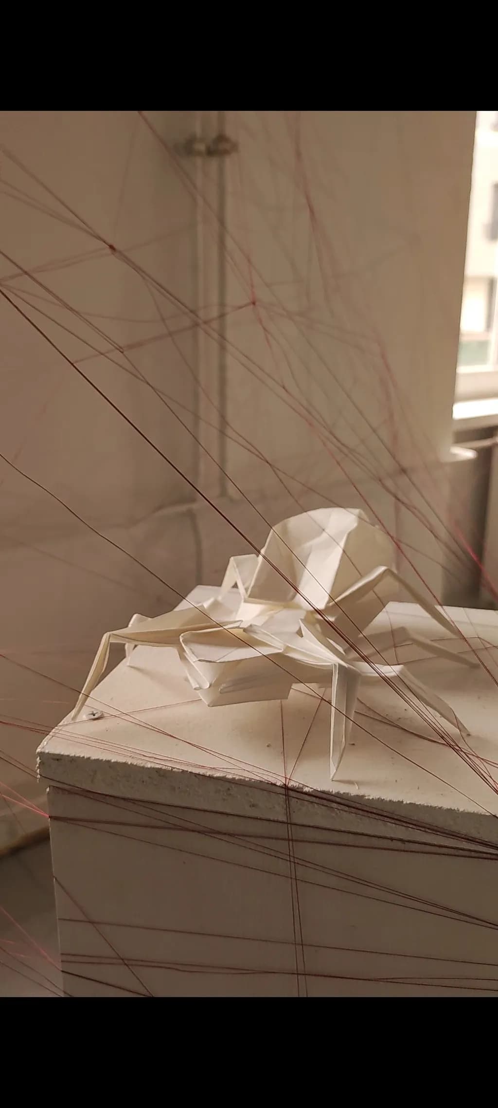 Delicate Threads: A Minimalist Origami Sculpture in White