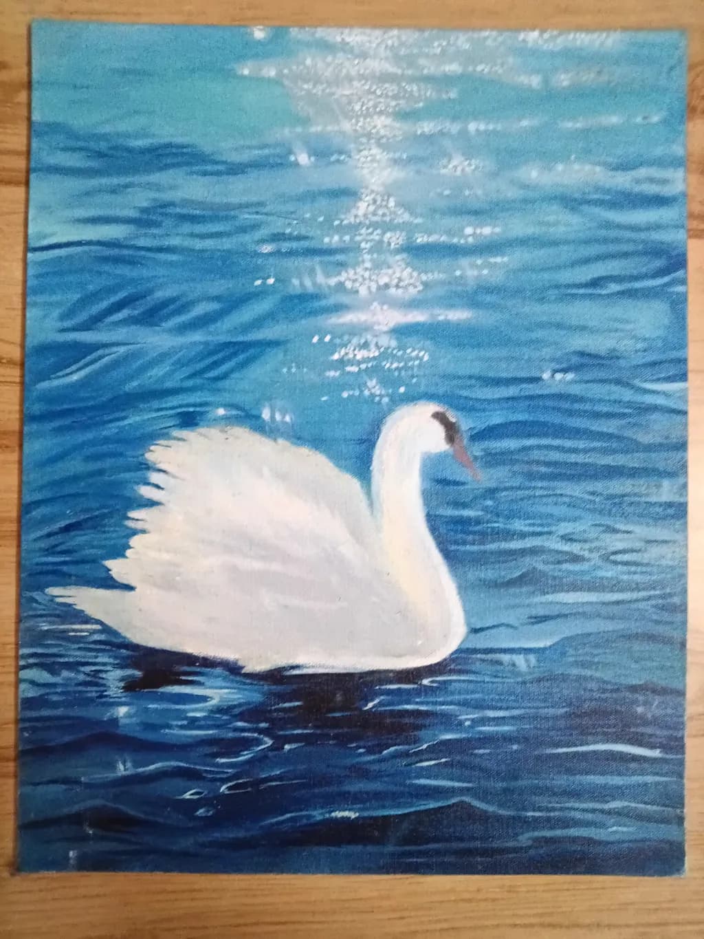 Serenity on Water: A Graceful Swan Gliding Through Tranquil Blue Waves