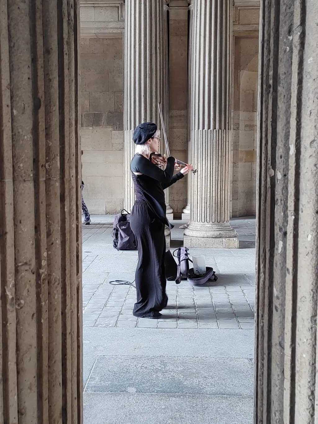 Violinist Among Columns