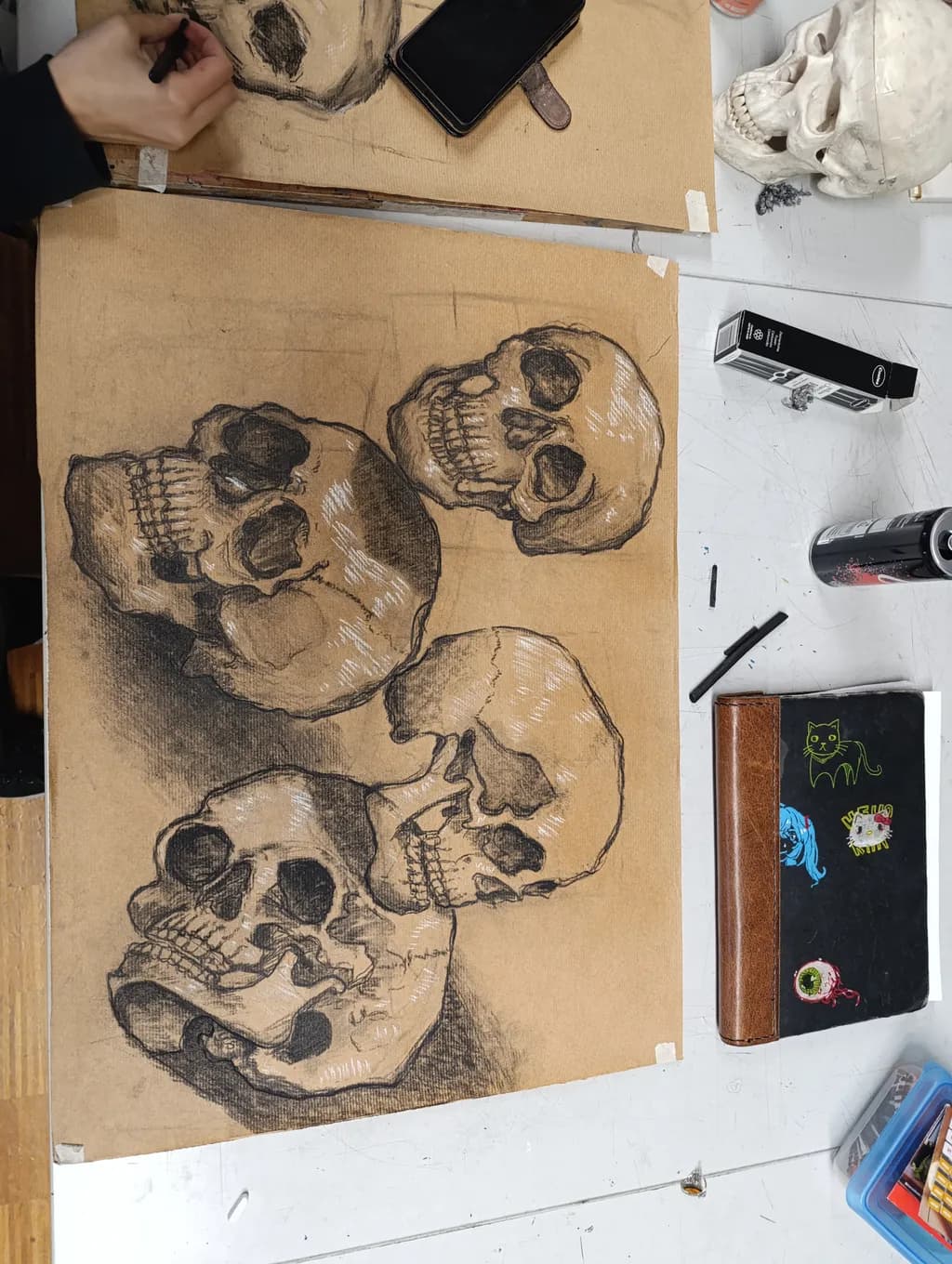 Whispers of Mortality: A Study of Five Skulls in Charcoal and Graphite