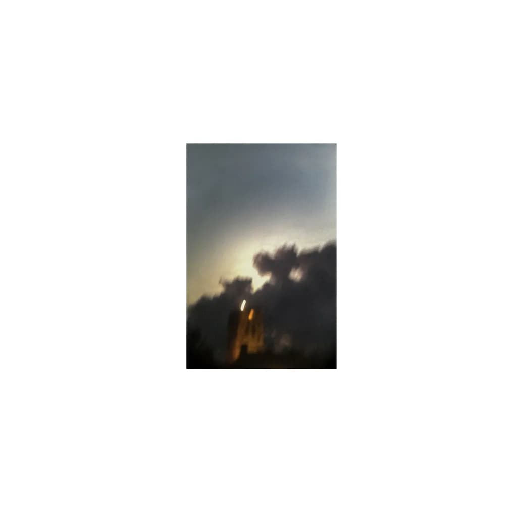 Twilight Whispers: A Dance of Clouds and Light Over the Cityscape