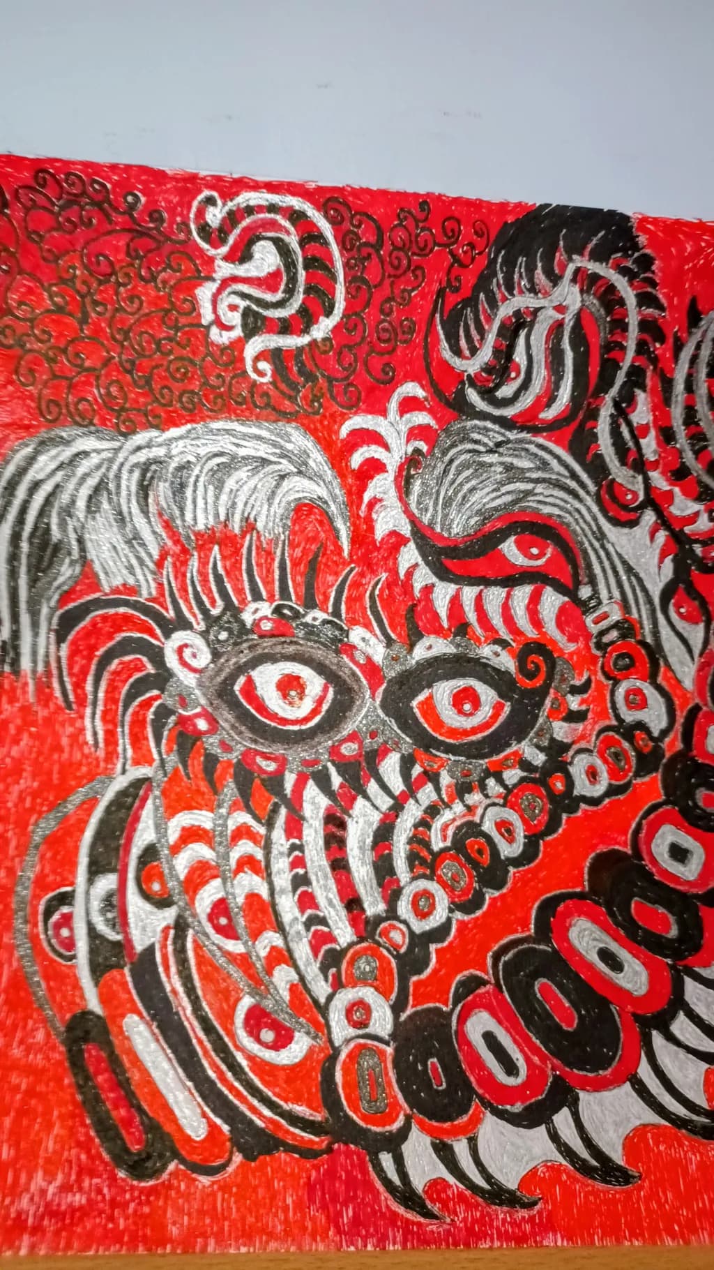 Vibrant Chaos: A Dance of Eyes and Spirals in Red and Black