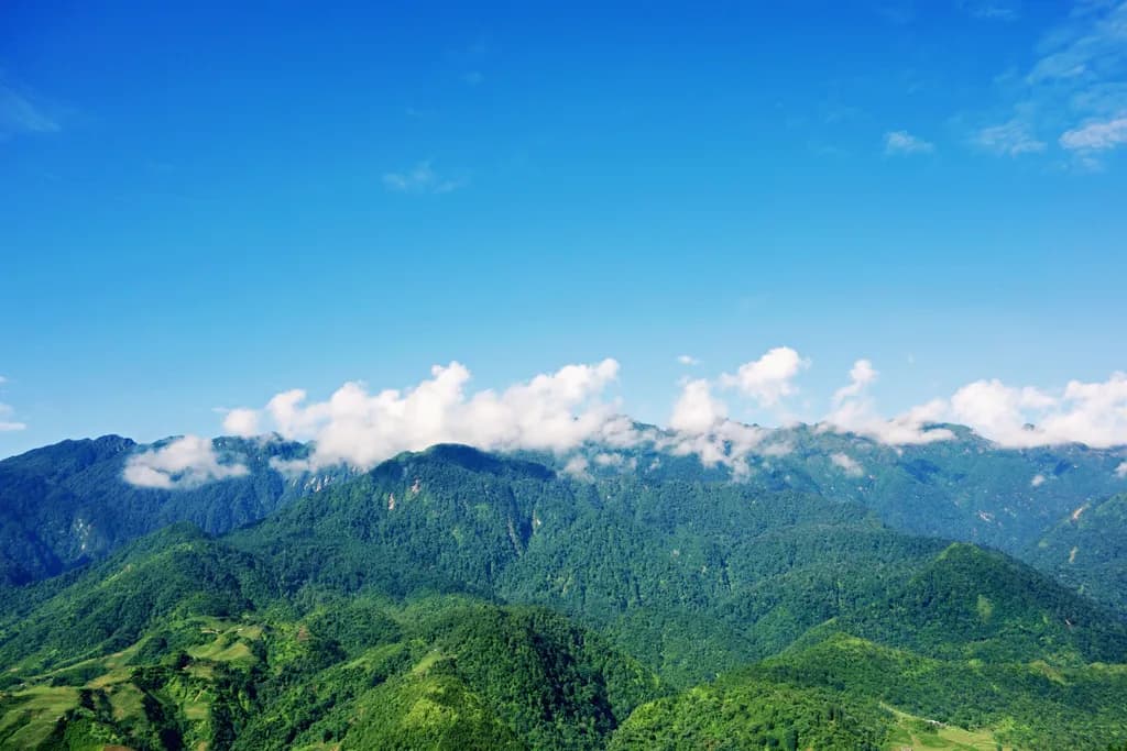 Whispers of the Mountains: A Serene Landscape Under a Vast Blue Sky