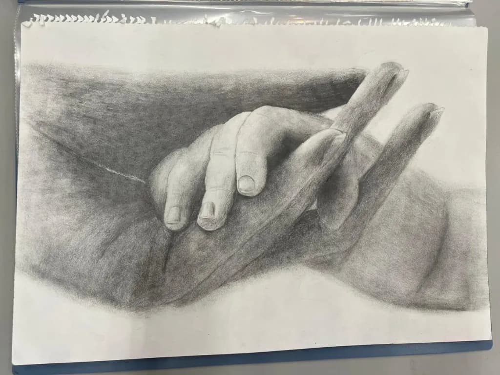 Embrace of Connection: A Charcoal Study of Hands Intertwined